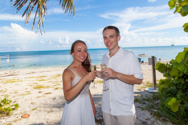 Wedding couple poses in front of the pool at the Southernmost Mansion in Key West Florida
